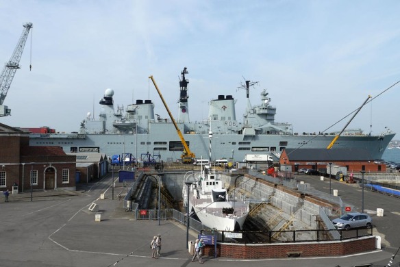 HMS Illustrious with HMS M.33 in the foreground